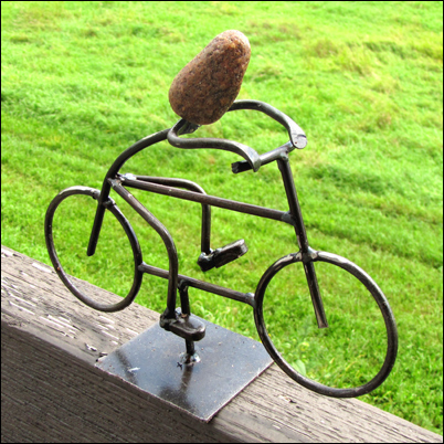 Bicycle Rider with Rock Head